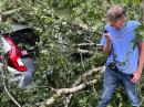 ARES Newsletter Editor Rick Palm, K1CE, surveys the damage after a tree fell on his car at his home. "Our cars were smashed under this big tree in our backyard. I am using my handheld to report into the Columbia County ARES net and EOC. Much damage here in our yard and the surrounding community, and we experienced a very scary (terrifying actually) morning yesterday, being so close to the eye as it made landfall," he wrote.